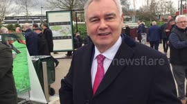Eamonn Holmes poses for photo with female fan as he arrives at Cheltenham Festival on Ladies Day