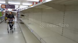 Empty shelves at UK store as coronavirus fears spark stockpiling