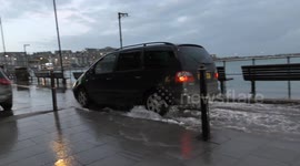 High spring tide floods St Ives seafront in Cornwall
