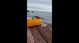 Seaglass provides some color on a calm cloudy day on Lake Superior.