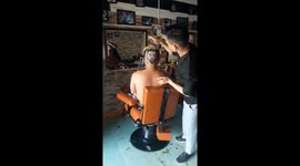Barber shaves Lionel Messi's face into the hair of football fanatic