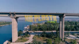Greenpeace activists unveil a 50-foot banner under highway in Bulgaria