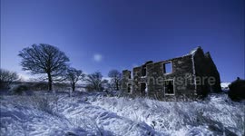 Time Lapse of Derelict House In Moonlit Snow