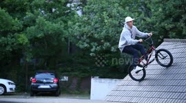 Man on BMX Bike does crazy trick