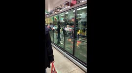 Man wears mask grocery shopping in Hollywood California as panic and fear of the Corona virus pandemic consumes society