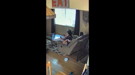 US woman leaps from sofa as spider descends from ceiling and lands near her