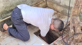 Dog owner in Thailand climbs INTO DRAIN to rescue his lost pet
