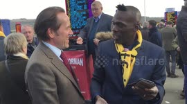 Actor Ben Miller shakes hands with racegoers at Cheltenham Festival