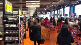 Coronavirus fears see Toronto locals empty shelves and form huge queues at supermarket