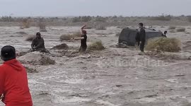 Heroic moment man rescues two others from a flash flood in California