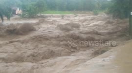 RAW: Flash floods hit market and cut-off bridges in Indonesia