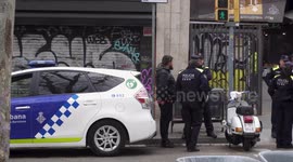 A guy is talking to Spanish police officers during the Coronavirus Lockdown in Barcelona