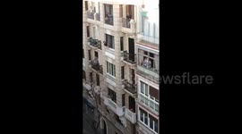 Coronavirus: Light-hearted moment locked-down Madrid neighbours hit tennis ball across street