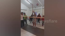 Pinata fail! Woman hurls stick at camera