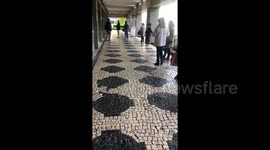 Queues form on Portuguese highstreet as only 100 customers allowed in at once during COVID-19 pandemic