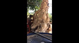 Vietnamese man transforms two-metre-tall tree stump into sculpture of Buddha