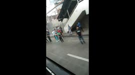 Long queues for trains as 'social distancing' rules are enforced in Manila