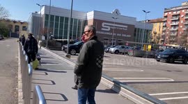 Large spaced-out queues seen at supermarket in central Italy