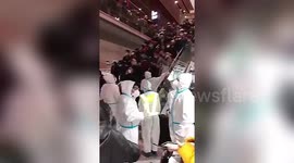 Overseas travellers waiting to be quarantined are stranded at Beijing International Airport