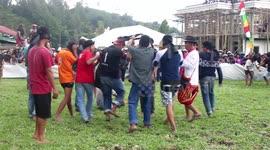 Indonesian locals participate in traditional 'pig catching' contest