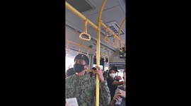 Soldiers board bus to check documents during lockdown in Manila