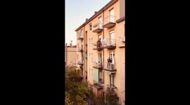 Singer plays from balcony during Italy’s lockdown for coronavirus