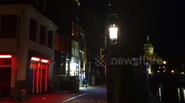 Church bells ring and people of Amsterdam applaud healthcare workers for tackling pandemic