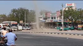 Huge dust devil whips through Indian road stalling traffic