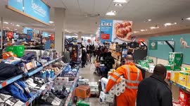 Long queues become the norm in UK supermarkets as panic buying continues