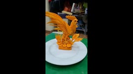 Vietnamese man sculpts CARROT into beautiful 'rooster artwork' like a pro