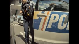 New Zealand police caught on camera admiring Tesla