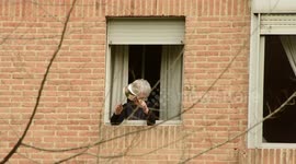 In Spain, quarantined protesters hang out of their windows banging pots and pans in anti-monarchy protest