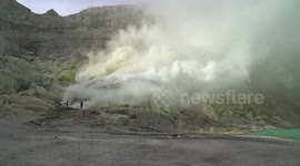In clouds of poisonous gas the sulphur miners of Indonesia work hard to feed their families