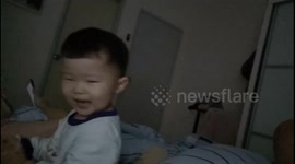 Funny toddler forces his dad to suck pacifier