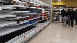 Tesco Shelves Are Stripped and Laid Bare By Customers Panic Buying