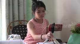 A Thai school girl studying online because of the virus pandemic.