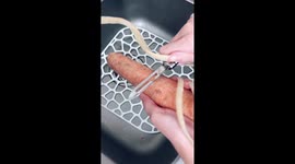 Peeling carrot with long nails