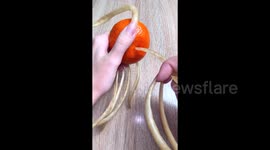 Peeling mandarine with my long nails