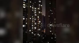 Residents sing Chinese national anthem out of windows to celebrate no increase in Wuhan coronavirus cases