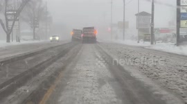 Winter returns to North America as snow plough clears a path for motorists during storm in Sioux Falls