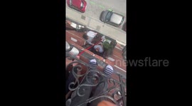 Library, quarantine style! Madrid residents exchange books from their balconies using ribbon in act of COVID-19 solidarity