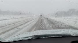 Car in ditch in South Dakota as snow and harsh conditions impair roads