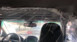 Coronavirus: Shanghai taxi driver uses plastic curtain to separate himself from passengers