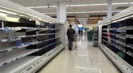 Coronavirus stockpiling leaves food shelves stripped bare at TESCO superstore - London