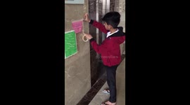 Child in India sets up matchstick board so people can use elevator without risking coronavirus contact