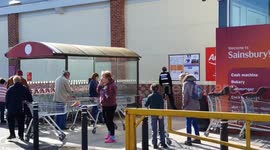 People queuing for supermarket to open