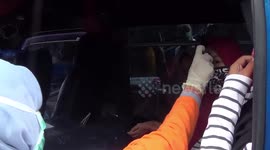 Prevent the entry of Corona Virus, Border Cities in Indonesia Guards Strictly. Bus Disinfectant Sprayed, Passenger in body temperature check