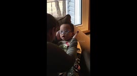 Baby seeing his adopted family clearly for the first time