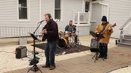 Church band performs outside during 'drive-up' Sunday service amid corona virus pandemic