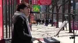 Amazing South Korean busker performs to cheer up Toronto people as they shop for essential supplies amid  COVID-19 pandemic which has closed most businesses and left thousands unemployed in the city